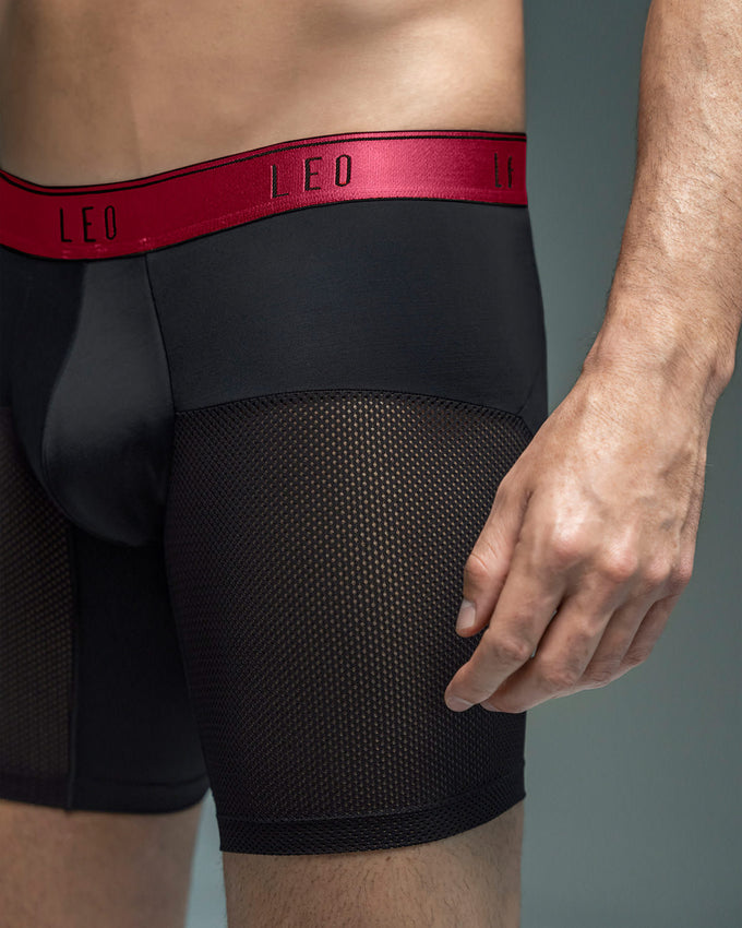boxer-medio-de-secado-rapido-con-mallas-transpirables#color_b15-negro-con-elastico-rojo