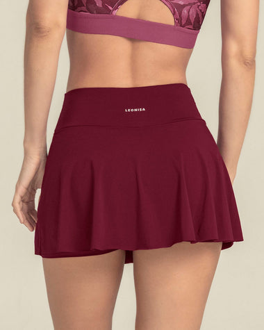 Falda deportiva con short interno con bolsillo#color_220-vinotinto